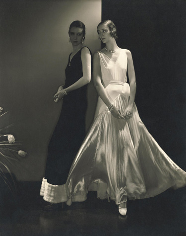 Model Marion Morehouse and unidentified model wearing dresses by